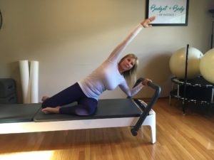 A woman relieivng stress with Pilates